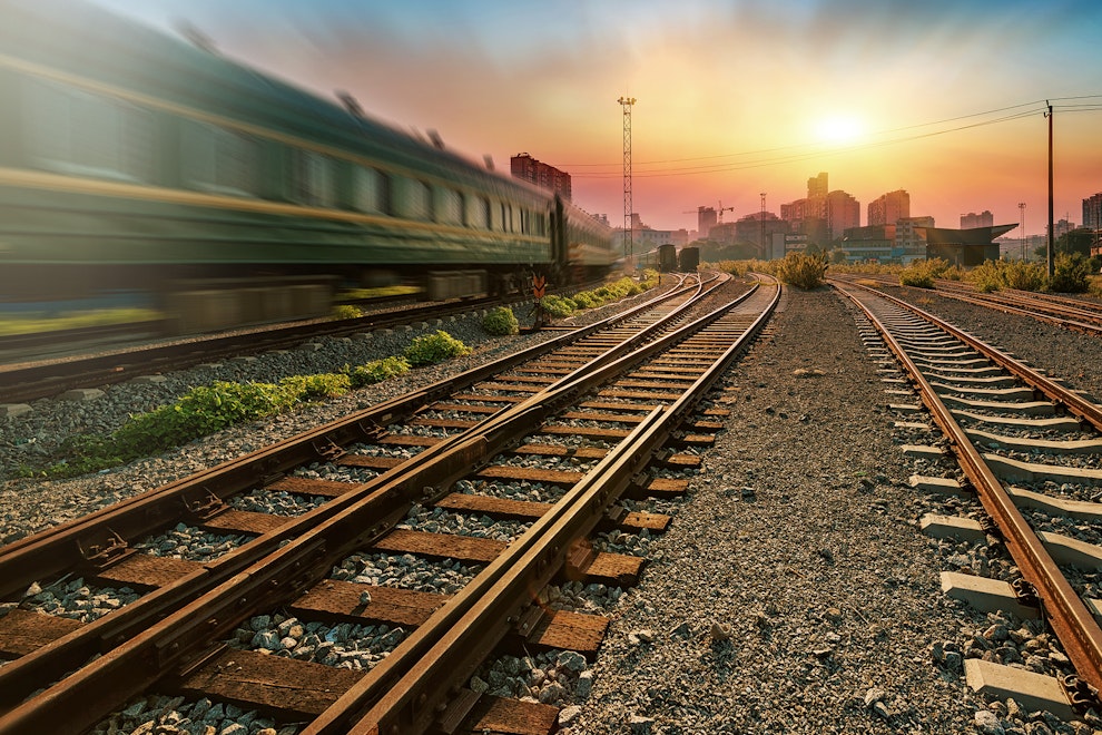 Platform of a goods train at sunset with container
